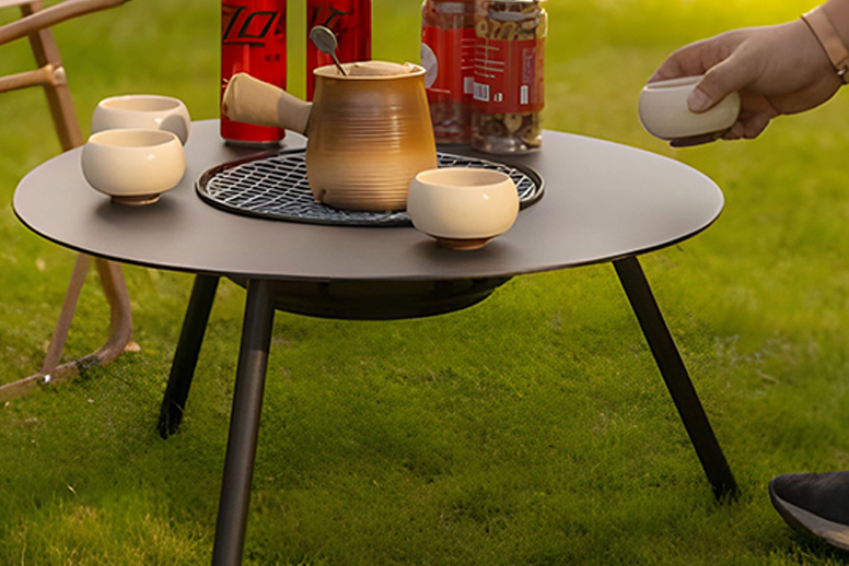 ¿Cómo las mesas de chimenea de metal mejoran su ambiente al aire libre y interior?